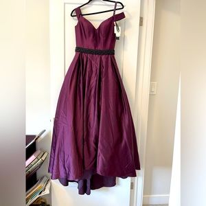 New beautiful party dress. Never worn. Tagged. Ask for more details
